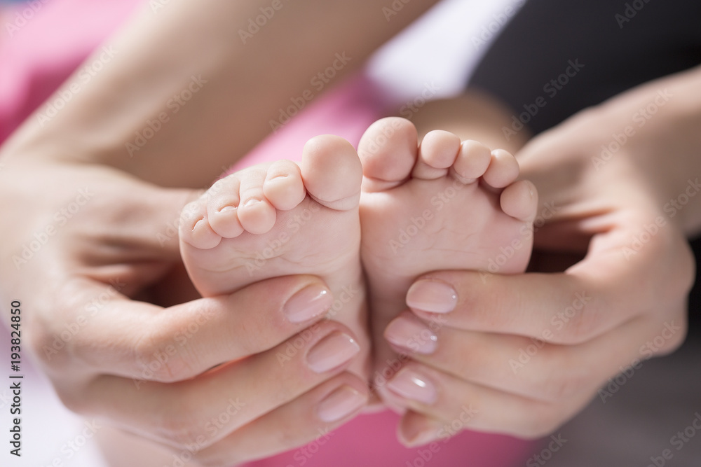Mother take a Baby Exercise for Relief from Baby Constipation, Selective focus Mother take a Baby Exercise for Relief from Baby Constipation, Selective focus