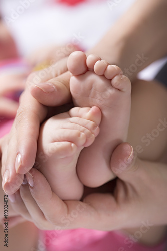 Mother take a Baby Exercise for Relief from Baby Constipation, Selective focus