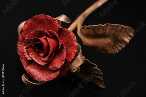 Εκτύπωση καμβά The fine rose made by a forging method of metal with a red blossom and a stalk of bronze color