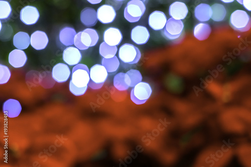 Abstract blurred of bokeh red and blue lights.  Blur of Christmas wallpaper decorations. Concept : xmas holiday festival backdrop and sparkle circle lit celebrations display.