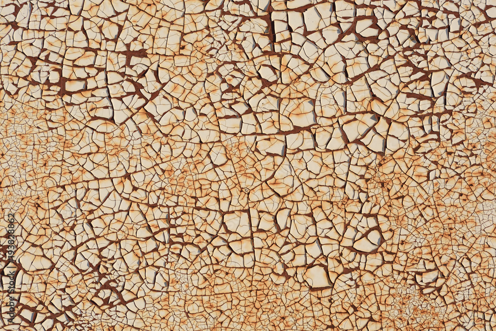 Rugged texture of finely cracked paint on rusty surface background Rugged texture of finely cracked paint on rusty surface background
