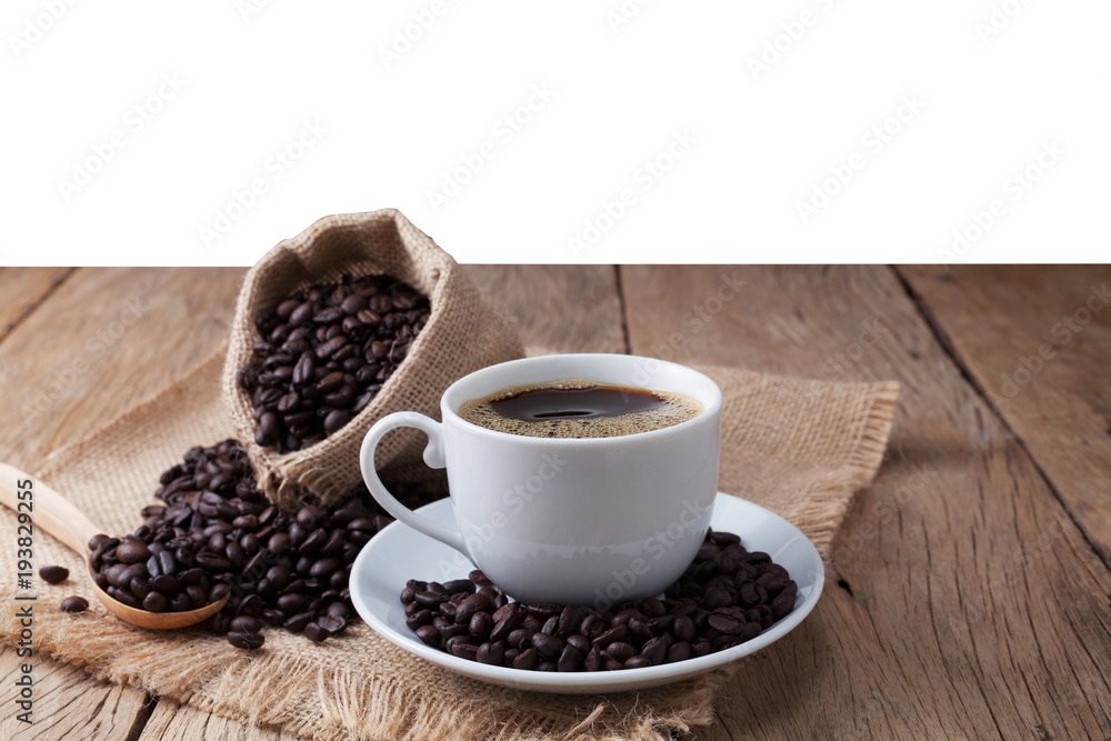 coffee cup and coffee beans on old wood plank background. coffee cup and coffee beans on old wood plank background.
