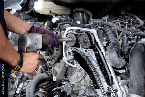 Professional mechanic repairing car engine