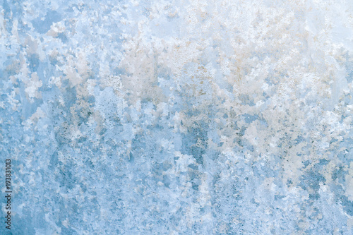 Winter frosty patterns on the frozen ice window © Viktoriya09