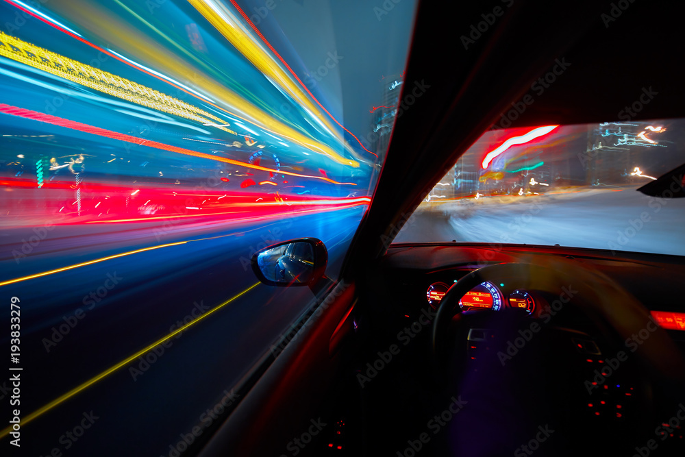 Obraz premium View from Side of Car moving in a night city