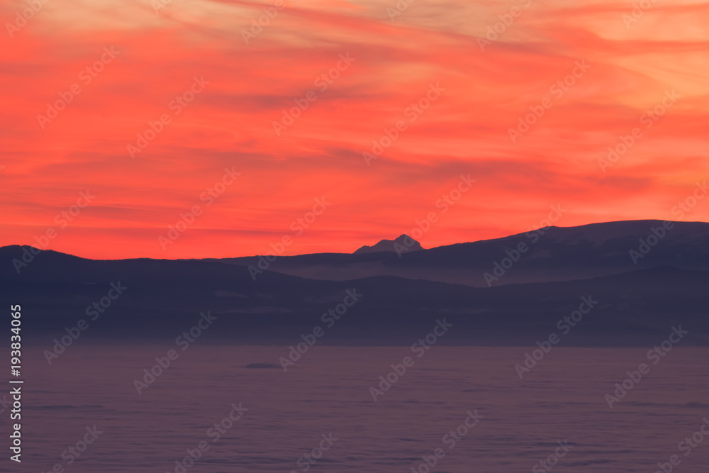 View from Schoeckl over low stratus to Triglav and sunset View from Schoeckl over low stratus to Triglav and sunset