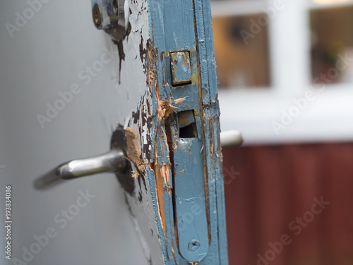 Картината върху платно Broken door in blue and white colors after a burglery