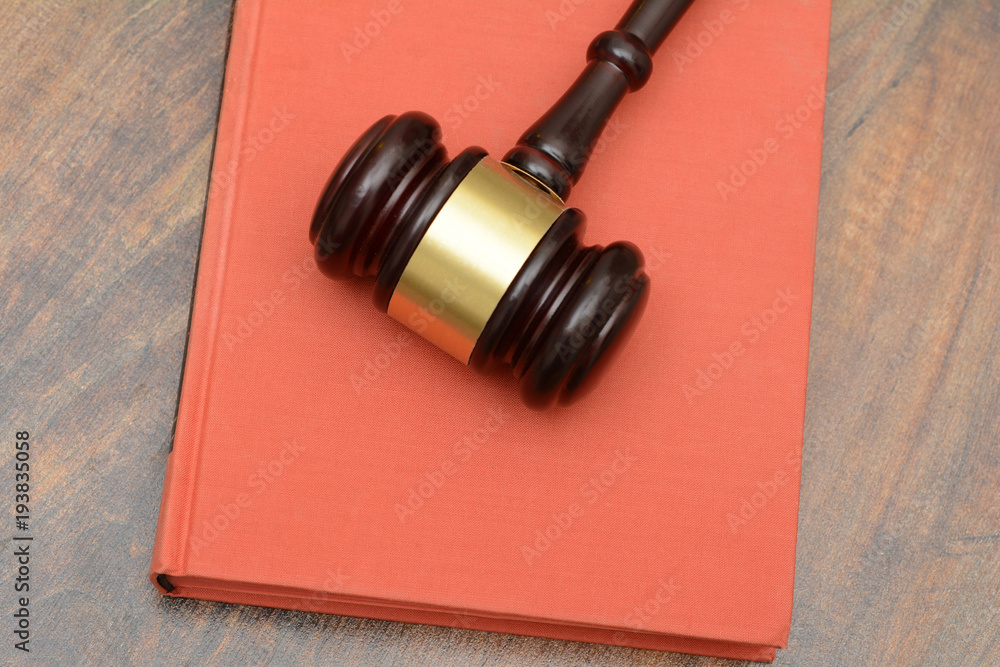 Wooden Gavel with red book law concept