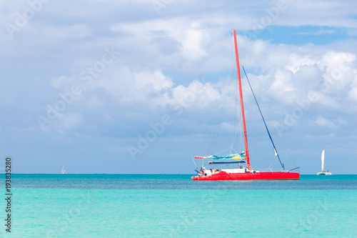 Red sailing catamaran