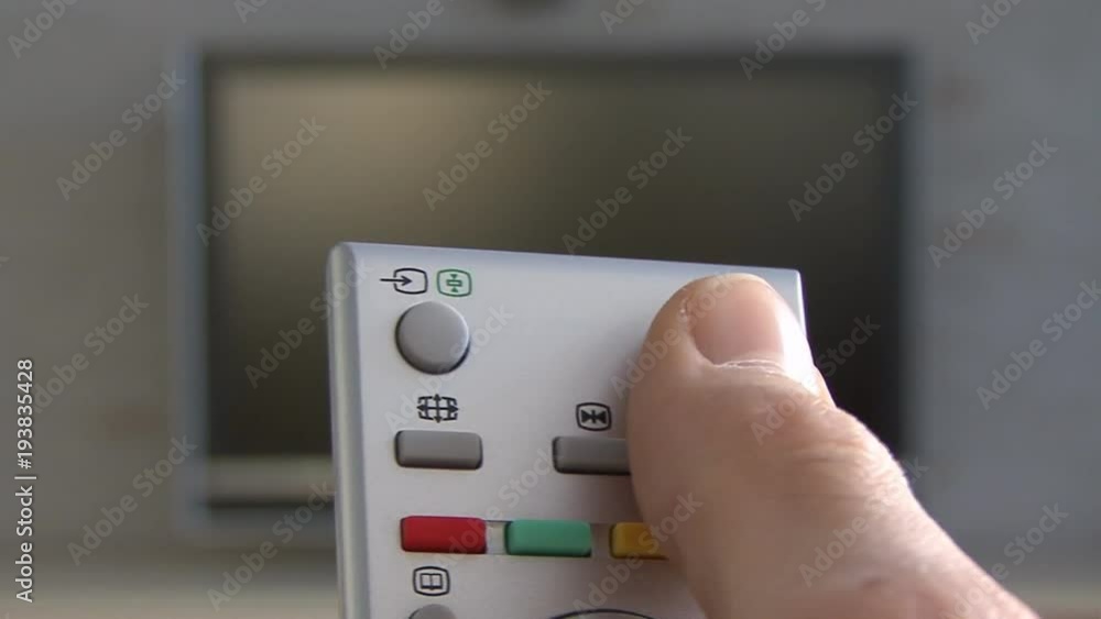 using a tv remote, tv in background 02 using a tv remote, tv in background 02