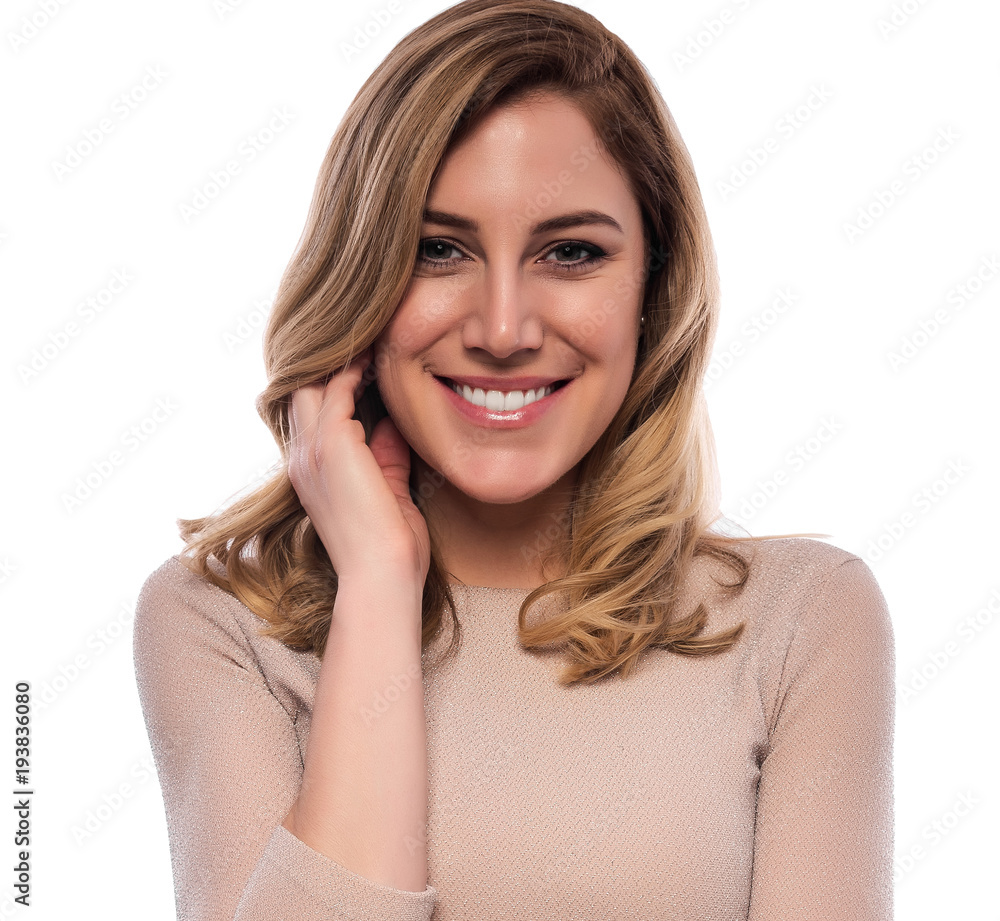 Attractive cute blonde. Close-up portrait on a white. Beautiful young woman in a flesh-colored dress. Attractive cute blonde. Close-up portrait on a white. Beautiful young woman in a flesh-colored dress.