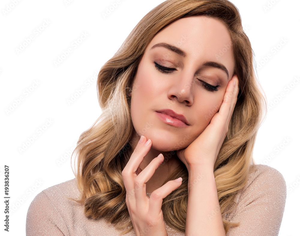 Attractive cute blonde. Close-up portrait on a white. Beautiful young woman in a flesh-colored dress. Attractive cute blonde. Close-up portrait on a white. Beautiful young woman in a flesh-colored dress.