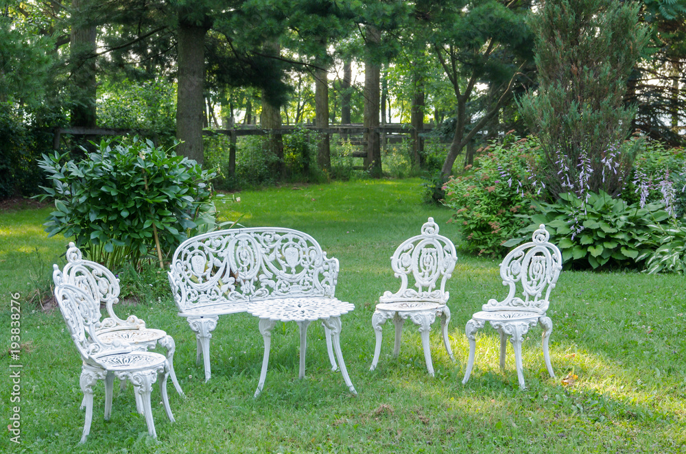 Decorative White Wrought Iron Furniture on Lawn Decorative White Wrought Iron Furniture on Lawn