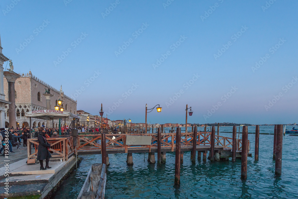 VENICE, ITALY - FEBRUARY 10 2018: Evening view of the pier in front of Hotel Cipriani near San Marco square