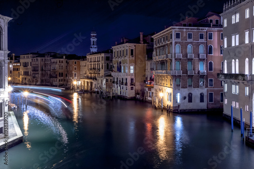 Games of light on the illuminated Grand Canal in the evening, Venice, Italy © Gianluca