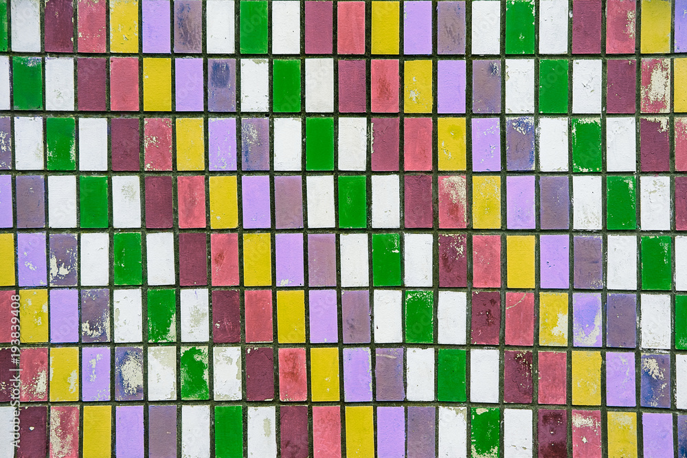 Fototapeta premium texture of old wall tiles with peeling bright paint.