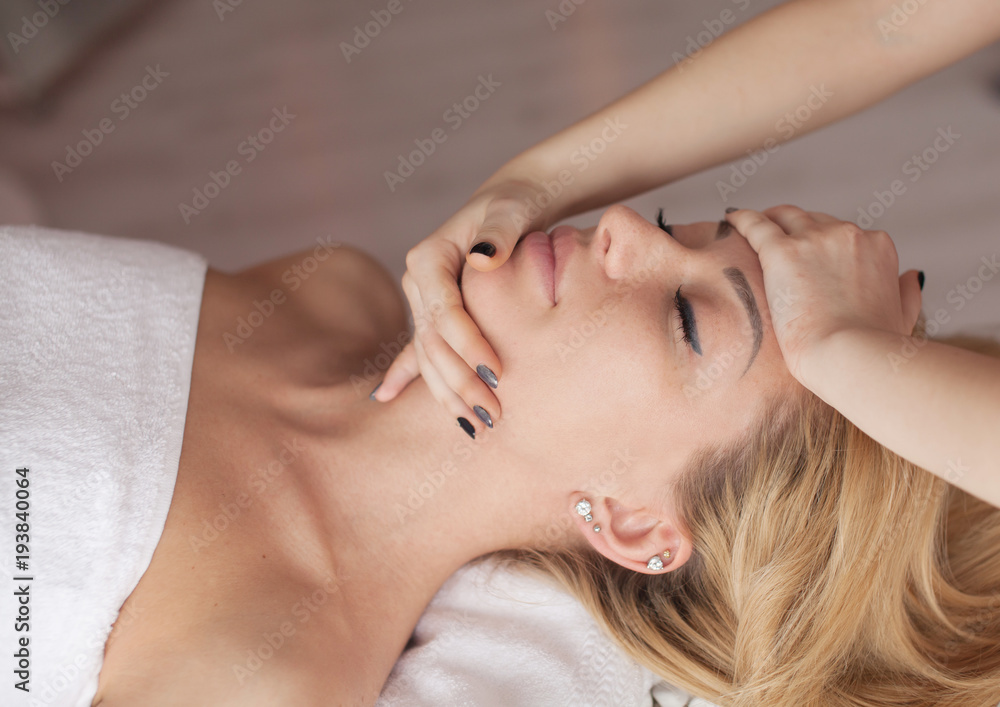 portrait of young beautiful woman in spa environment