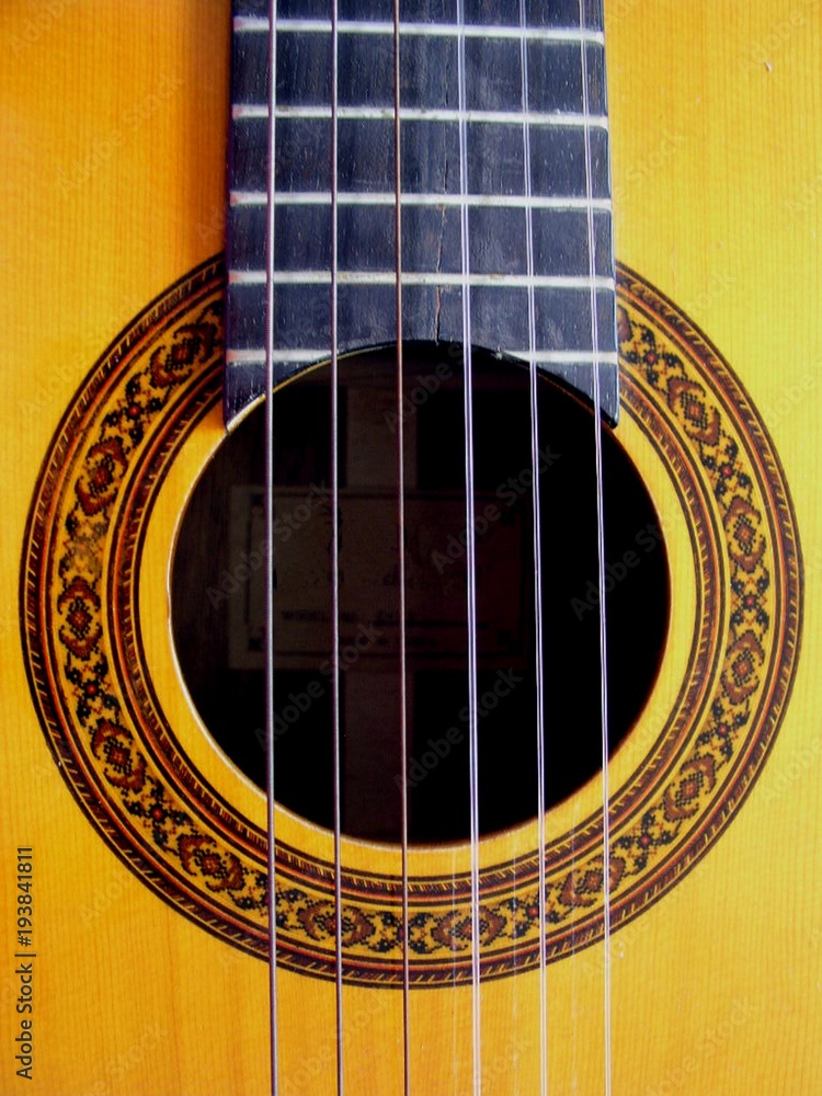Close Up of an Acoustic Guitar With Ornate Decorative Sound Hole Close Up of an Acoustic Guitar With Ornate Decorative Sound Hole