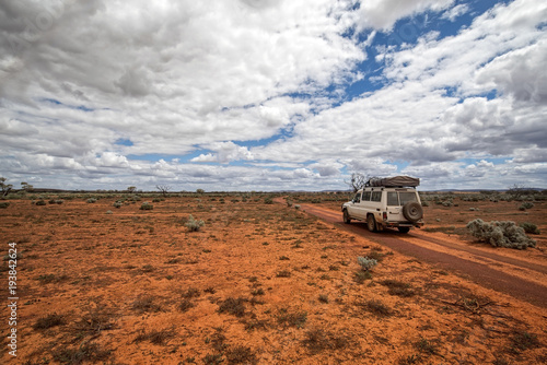 South Australia     Outback desert with 4WD track under cloudy sky as panorama