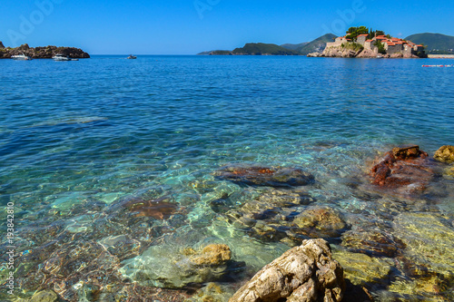 Fototapeta Naklejka Na Ścianę i Meble -  Sea. Large coastal colorful stones in the water at the shore. Clear water. Adriatic Sea