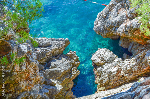 Nice view of the sea. Calm clear sea. Large stones. The Adriatic. Montenegro