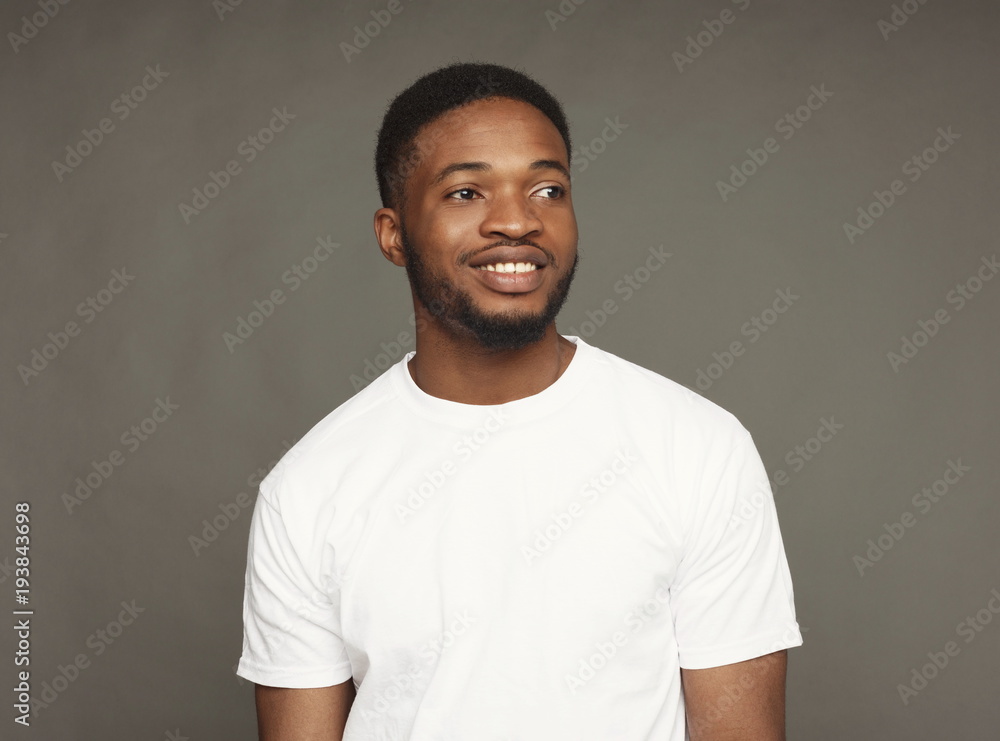 Facial expression, emotions, friendly black man smiling Facial expression, emotions, friendly black man smiling