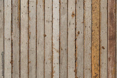 Old wooden background with knots and nail holes. Rustic style wallpaper. Timber texture