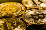 Golden bitcoins on black