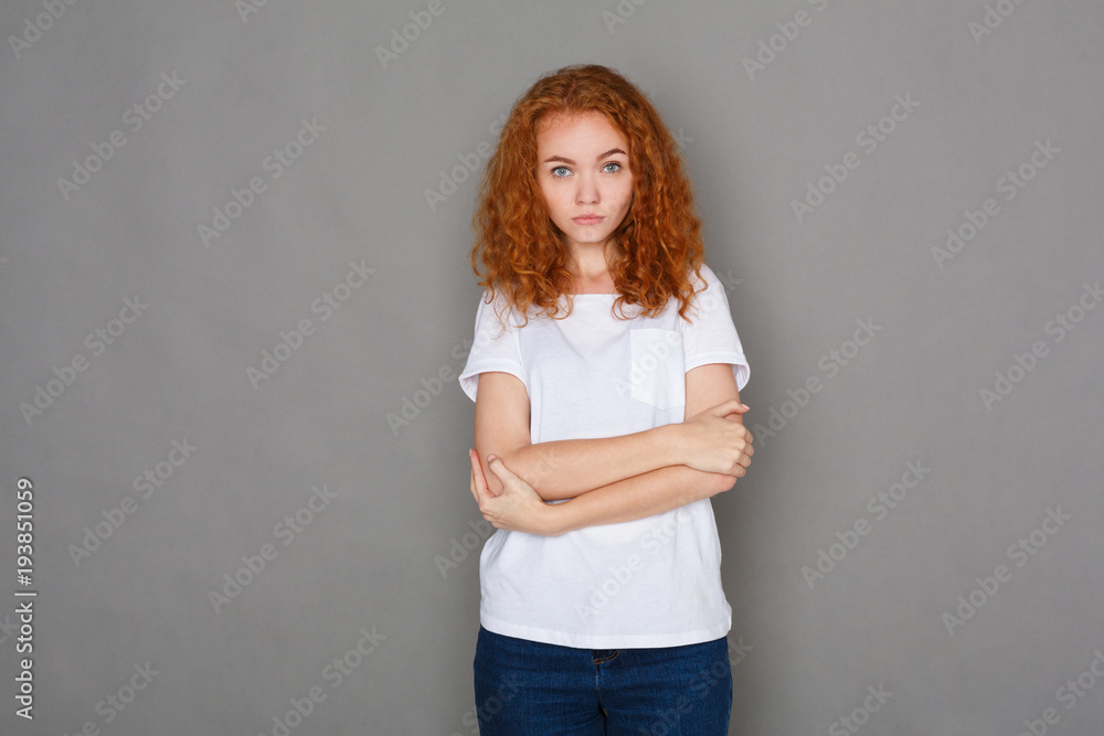 Serious girl in casual clothes posing at studio Serious girl in casual clothes posing at studio