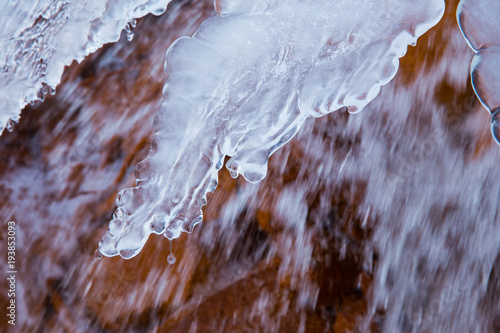 Red rock waterfall and  ice at Latvia. Travel photo. 2018 photo