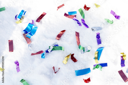 colored ribbons scattered in the snow