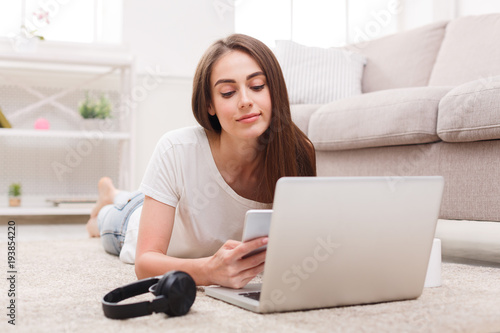Student girl using laptop and mobile phone