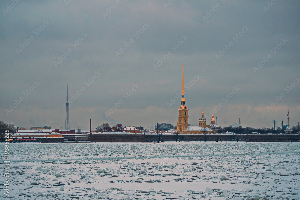 View of the Peter and Paul fortress and the Neva river, bound by ice.