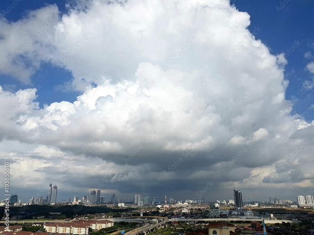 Big huge clouds covering over Johor Bahru's cityscape as storm is approaching in the afternoon