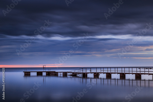 Wallpaper Mural long pier leading into the ocean at sunset Torontodigital.ca