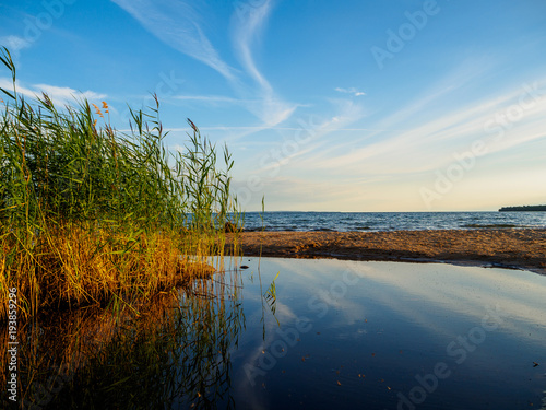 Beach  shore and reflections from the clouds