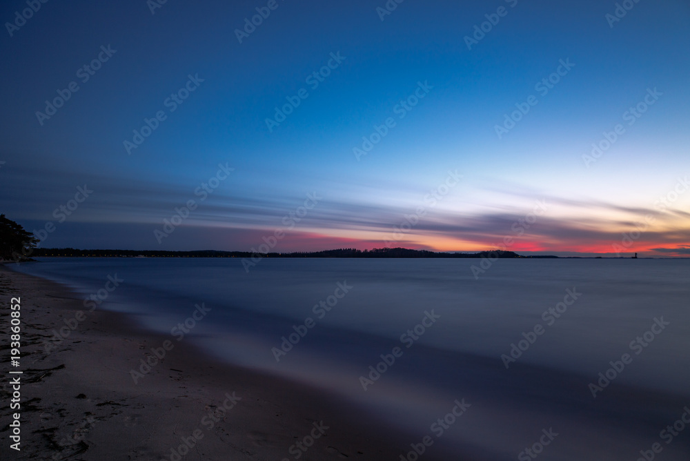 Long exposure of sunset at a sandy beach