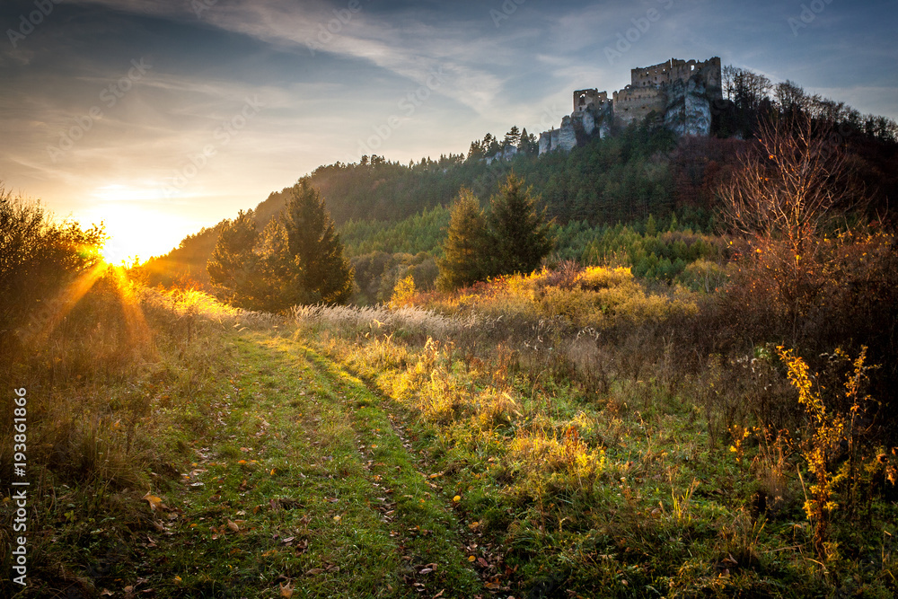 Landscape at sunset with ruin of medieval castle Lietava near Zilina town, Slovakia, Europe.