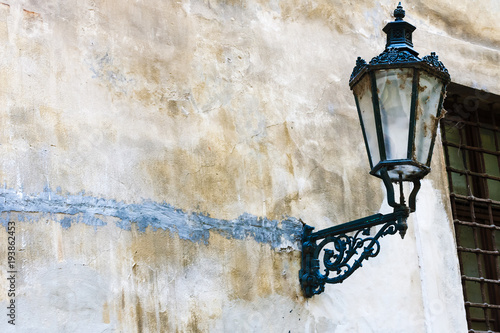 Vintage street lantern on the old wall on the streets of Prague, Czech Republic