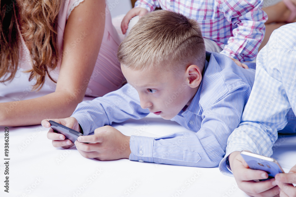 Children using electronic gadgets. Children using electronic gadgets.