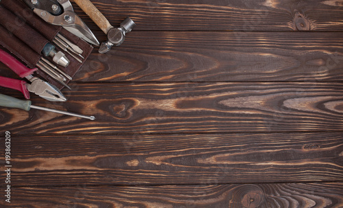 Close up tools on a wooden background