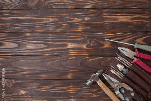 Close up tools on a wooden background