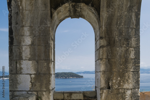 View across harbor from wall sightseeing point of New Corfu Fortress in June. Corfu town or Kerkyra , Corfu Island, Greece. 