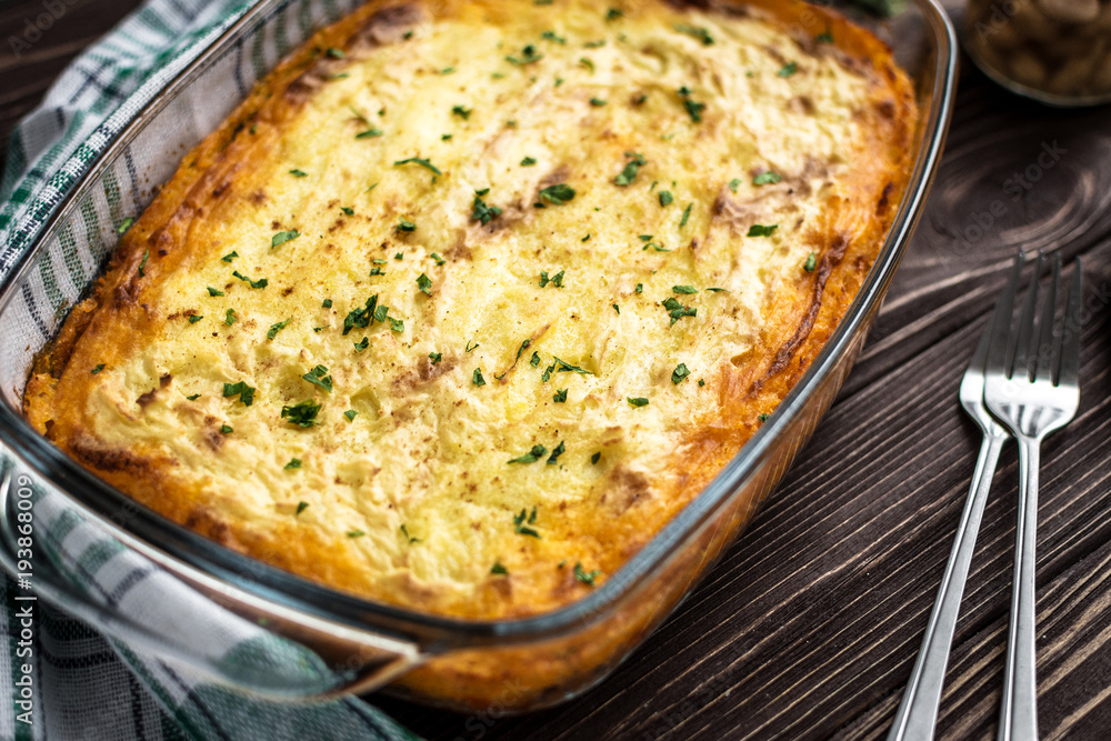 Shepherd's pie on a wooden background Shepherd's pie on a wooden background