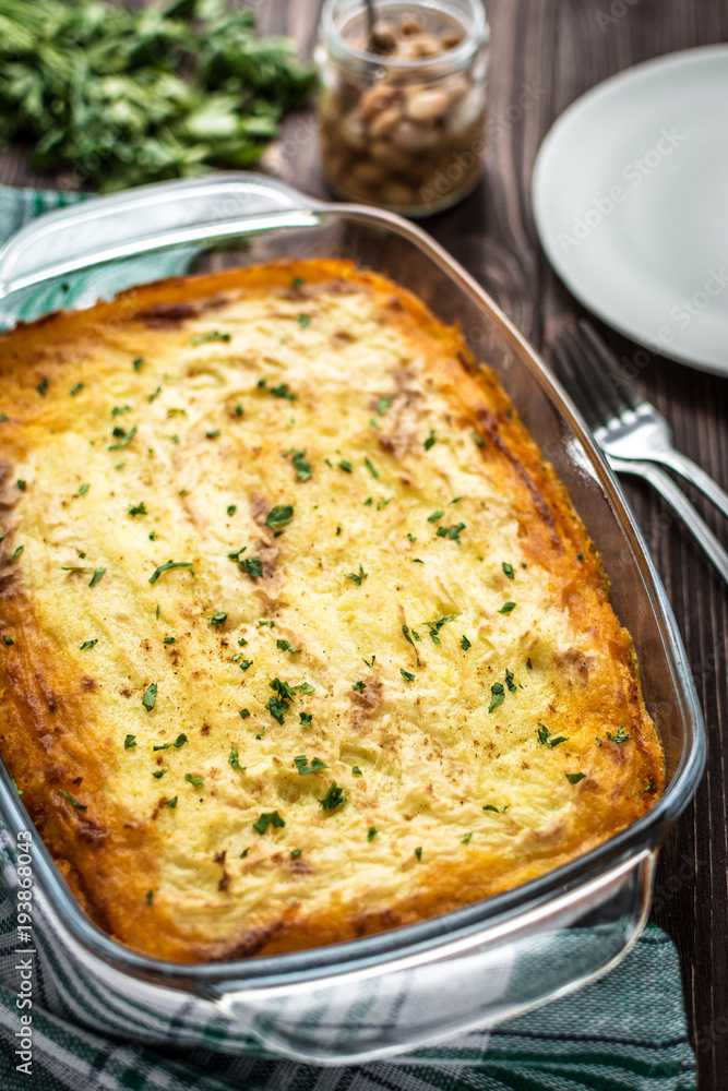 Shepherd's pie on a wooden background Shepherd's pie on a wooden background