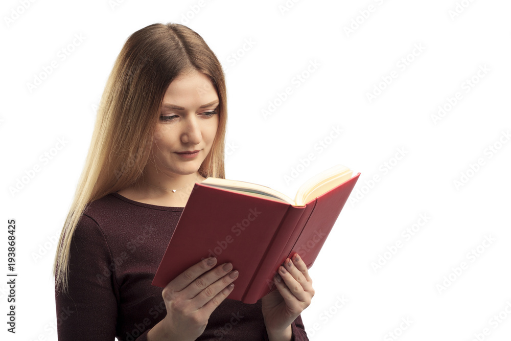 Young female happily reading book, isolated on white Young female happily reading book, isolated on white