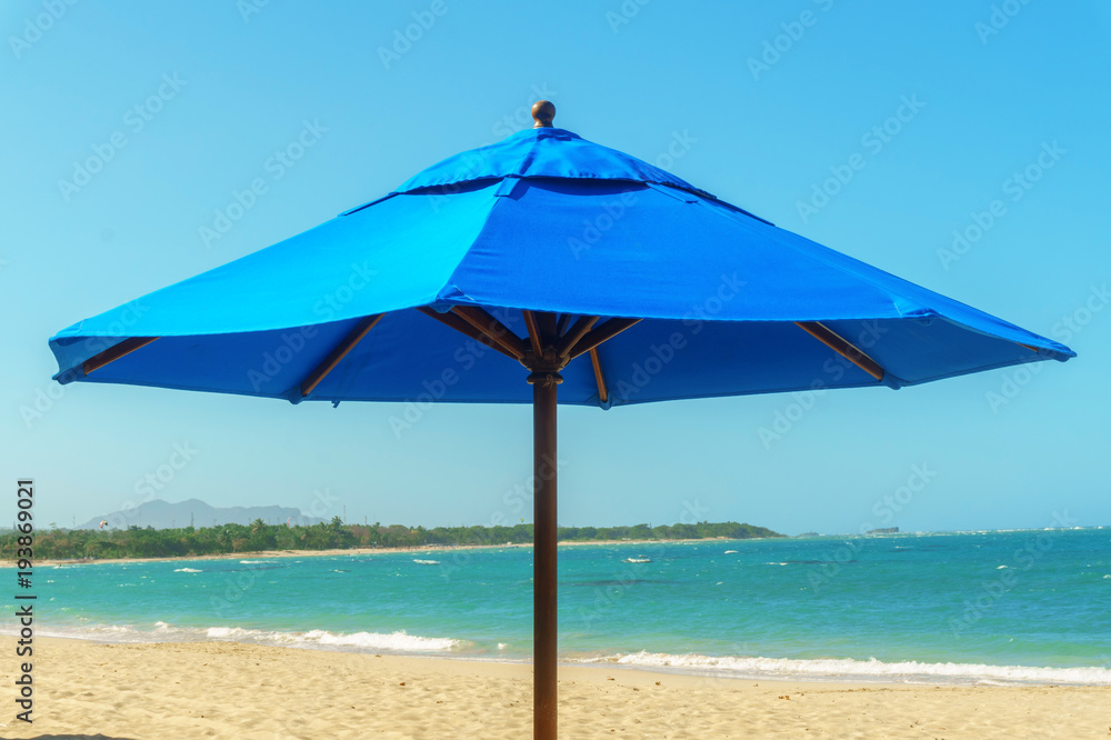 outdoor large blue sun umbrella on the beach