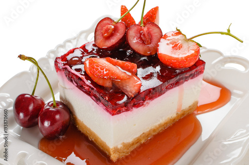 Delicious cheesecake with berries,fresh strawberry and cherry cheesecake on table.