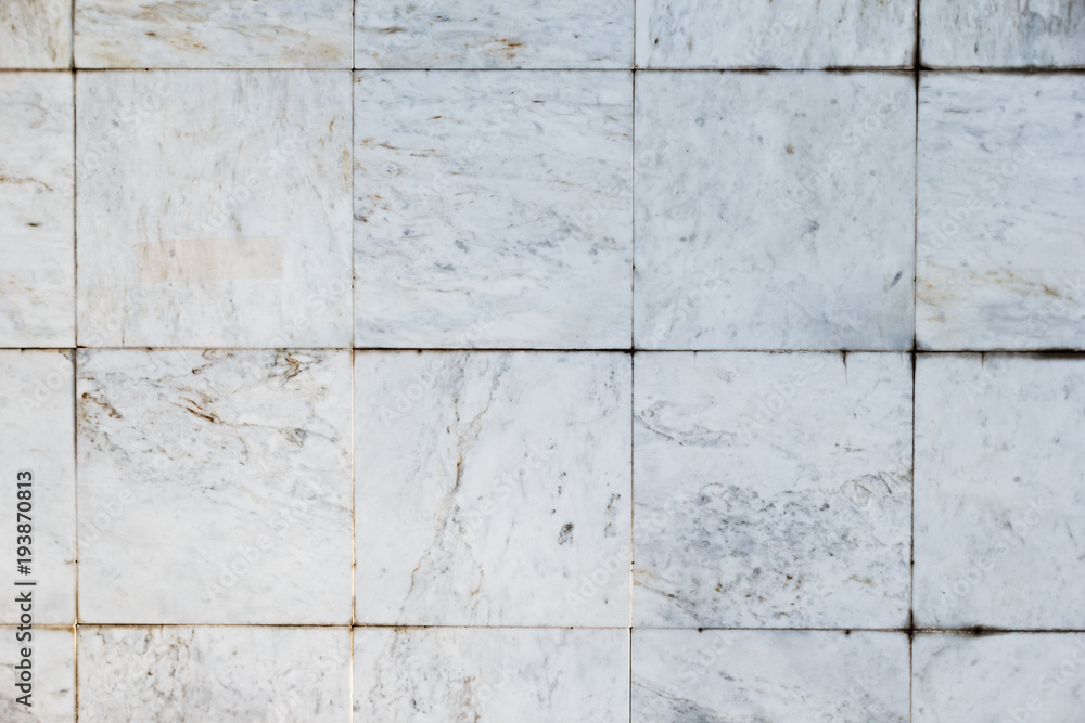 Naklejka premium Gray stone wall closeup background photo texture