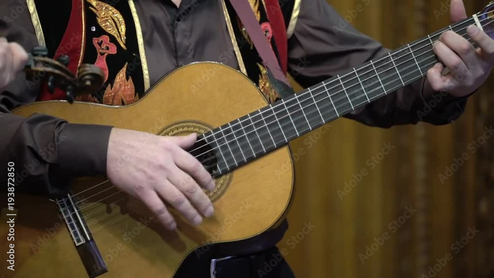 Man playing acoustic guitar indoors Man playing acoustic guitar indoors